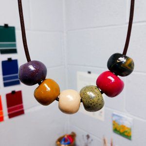 Polymer clay necklace beads: purple, ochre, red, b